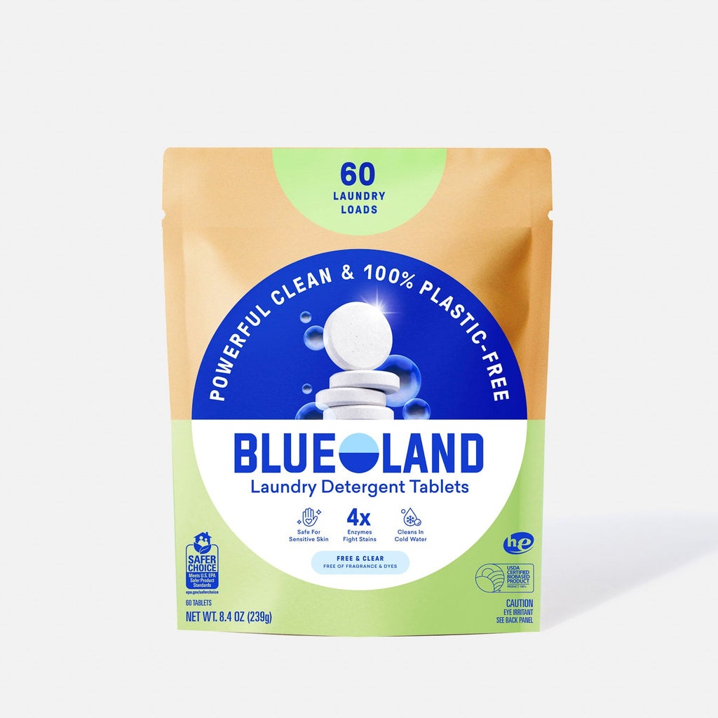 A package of Blueland Laundry Detergent Tablets with a tan, blue, and green design. It advertises 60 loads, 100% plastic-free packaging, and displays tablets stacked on the front.