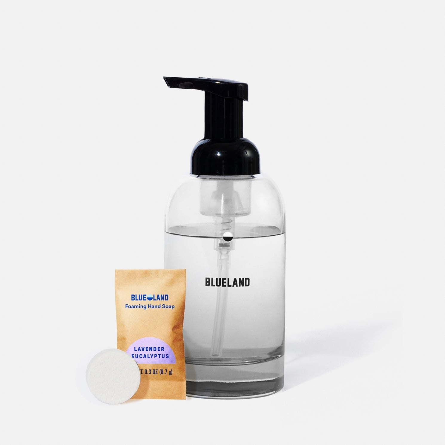 A bottle of liquid with a black pump.