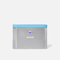 The Forever Tin is a rectangular silver container with a light blue lid and "BLUELAND" printed in white on the front—a stylish, eco-friendly tin designed for plastic-free storage.